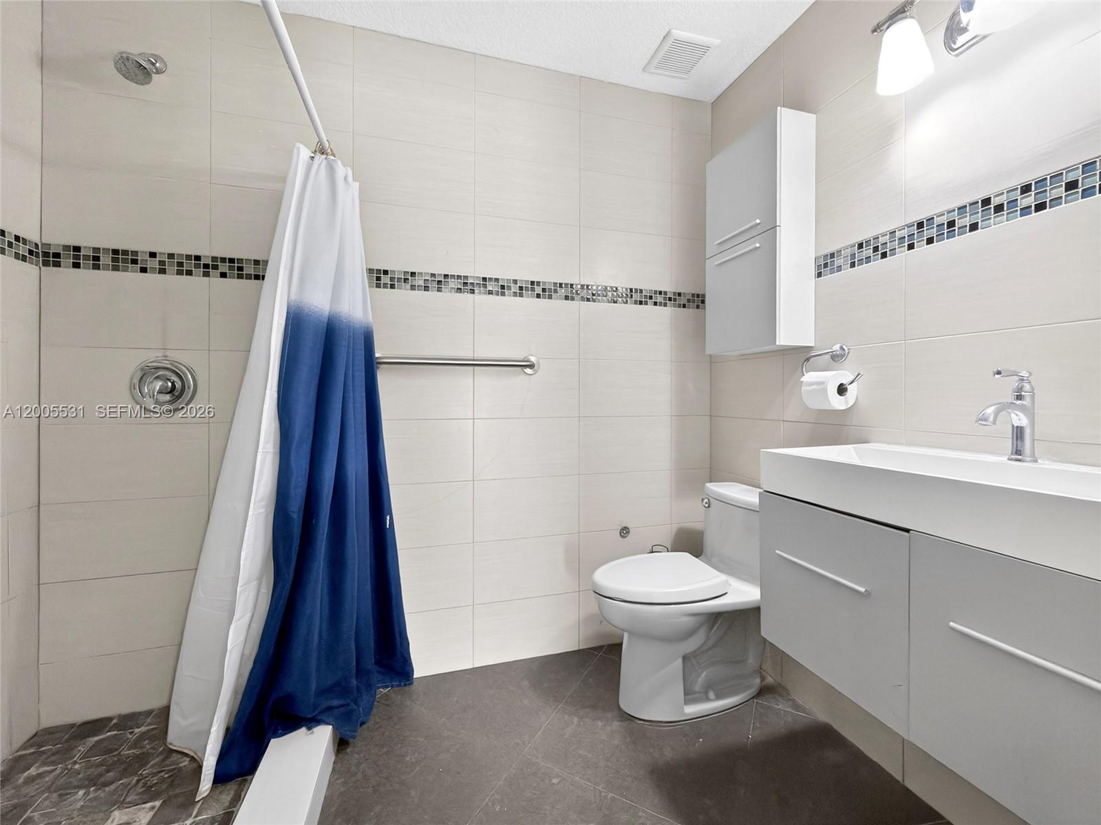 5310 Southwest 72nd Street Miami, FL 33143 - Photo 18 of 20 a bathroom with a sink toilet and shower