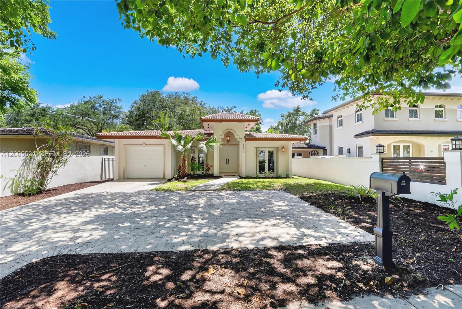 5310 Southwest 72nd Street Miami, FL 33143 - Photo 3 of 20 a view of a house with a yard