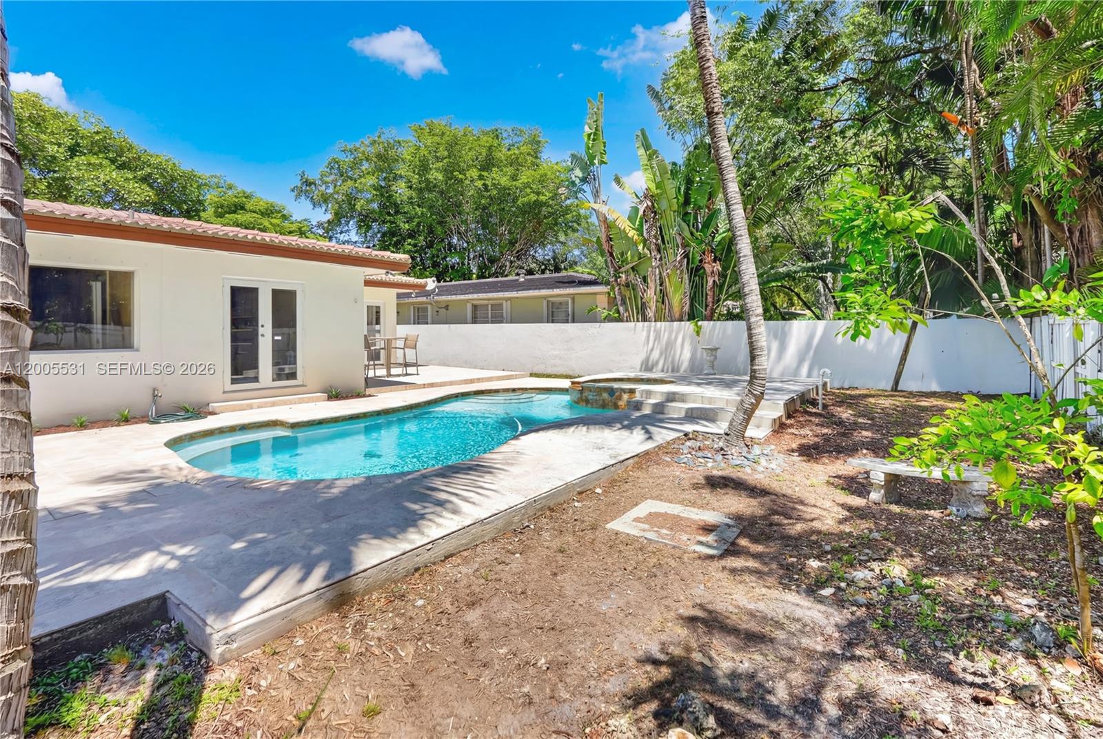5310 Southwest 72nd Street Miami, FL 33143 - Photo 4 of 20 a front view of a house with garden
