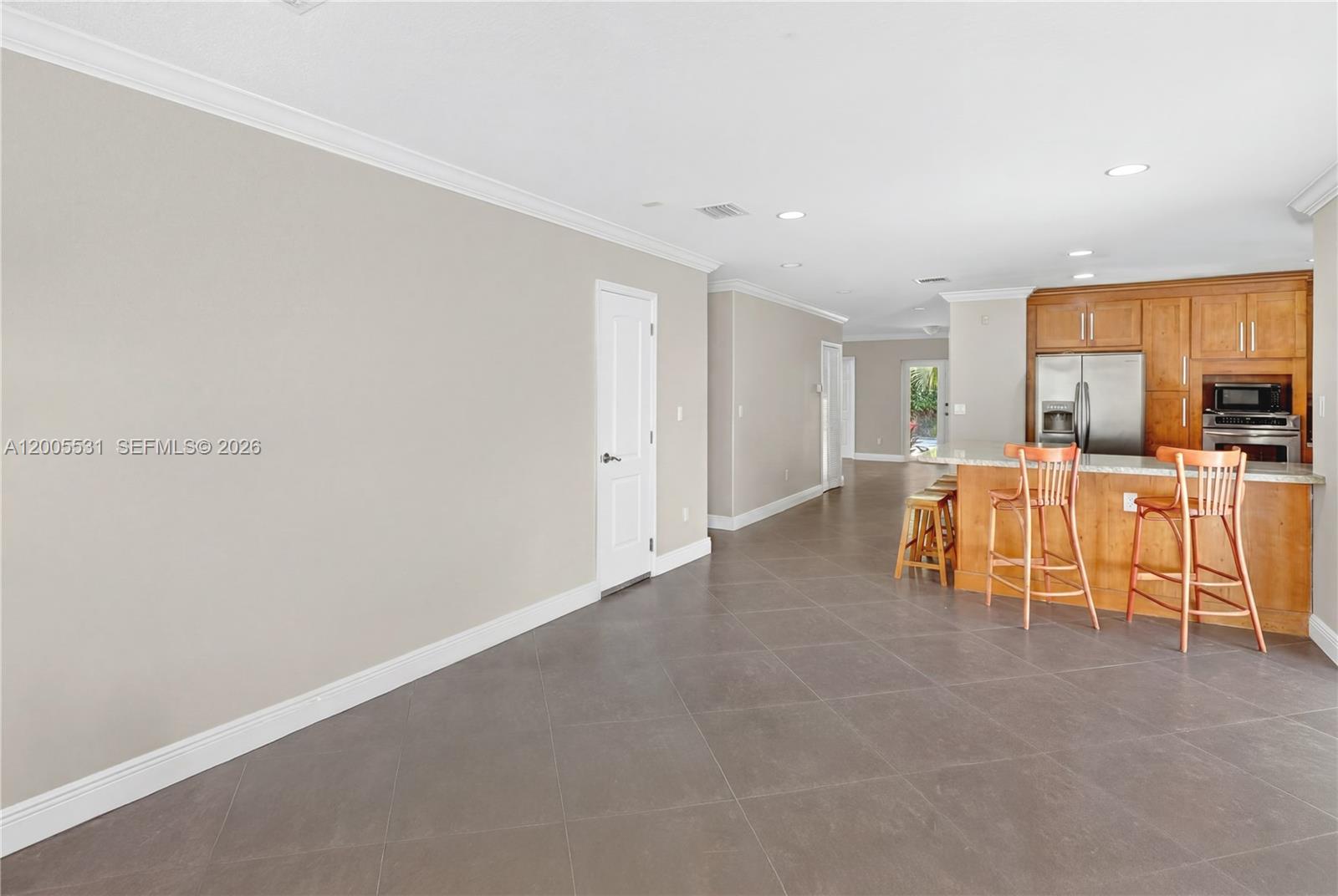 5310 Southwest 72nd Street Miami, FL 33143 - Photo 9 of 20 a view of living room filled with furniture and white walls