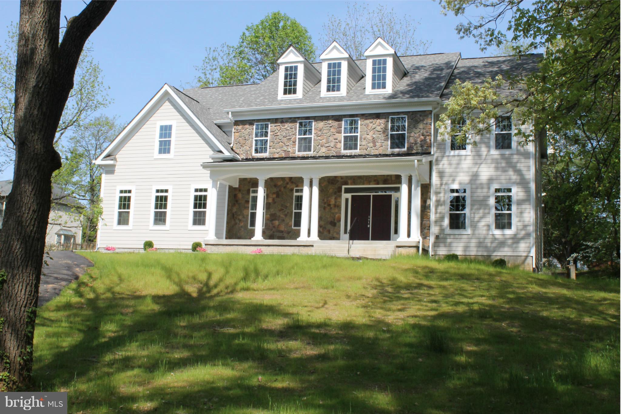 8536 Old Keene Mill Road Springfield, VA 22152 - Photo 1 of 30 a front view of a house with a garden