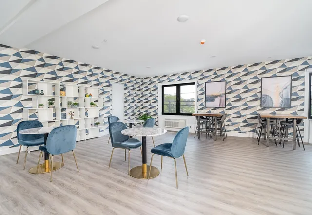 a view of a bedroom with a bookshelf