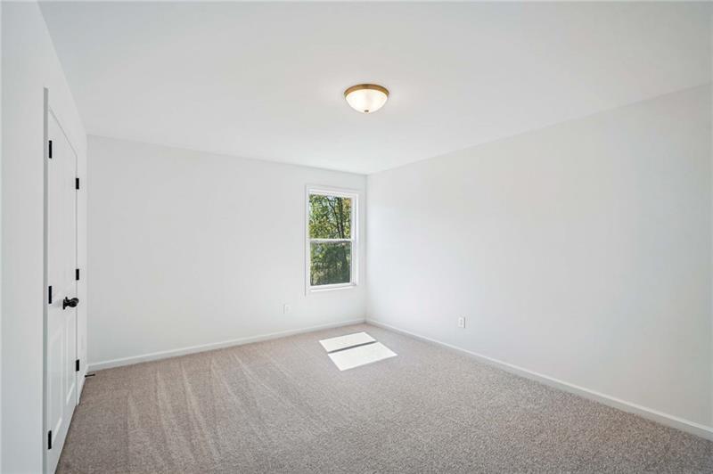 240 Silverleaf Trail Bethlehem, GA 30620 - Photo 23 of 35 an empty room with a empty space and a window