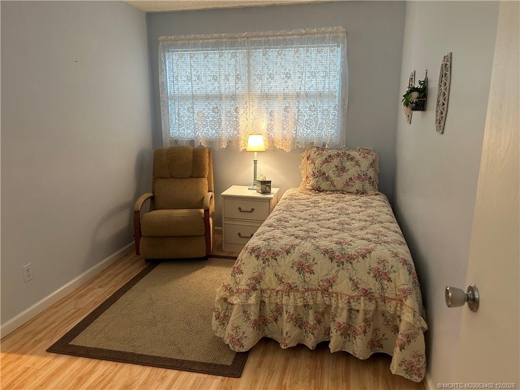 2950 Southeast Ocean Boulevard, Unit 1323 Stuart, FL 34996 - Photo 13 of 19 a bedroom with a bed and a window