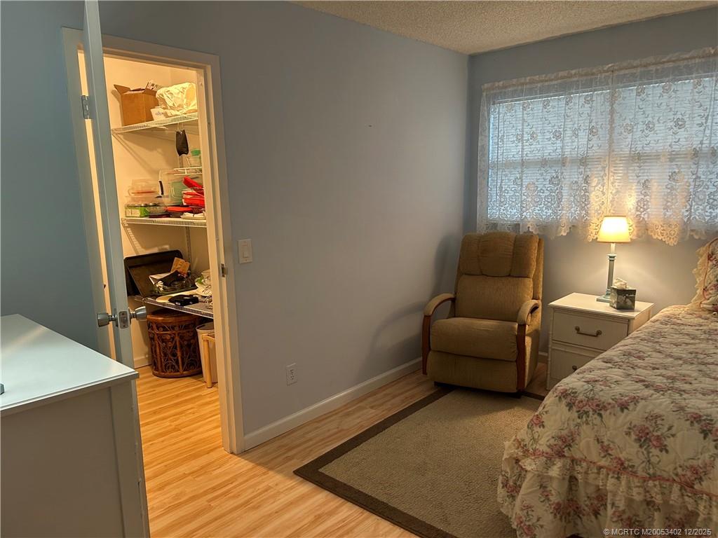 2950 Southeast Ocean Boulevard, Unit 1323 Stuart, FL 34996 - Photo 14 of 19 a living room with furniture and a fireplace