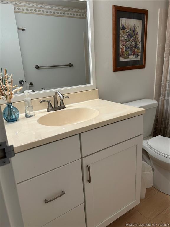 2950 Southeast Ocean Boulevard, Unit 1323 Stuart, FL 34996 - Photo 16 of 19 a bathroom with a sink and a toilet