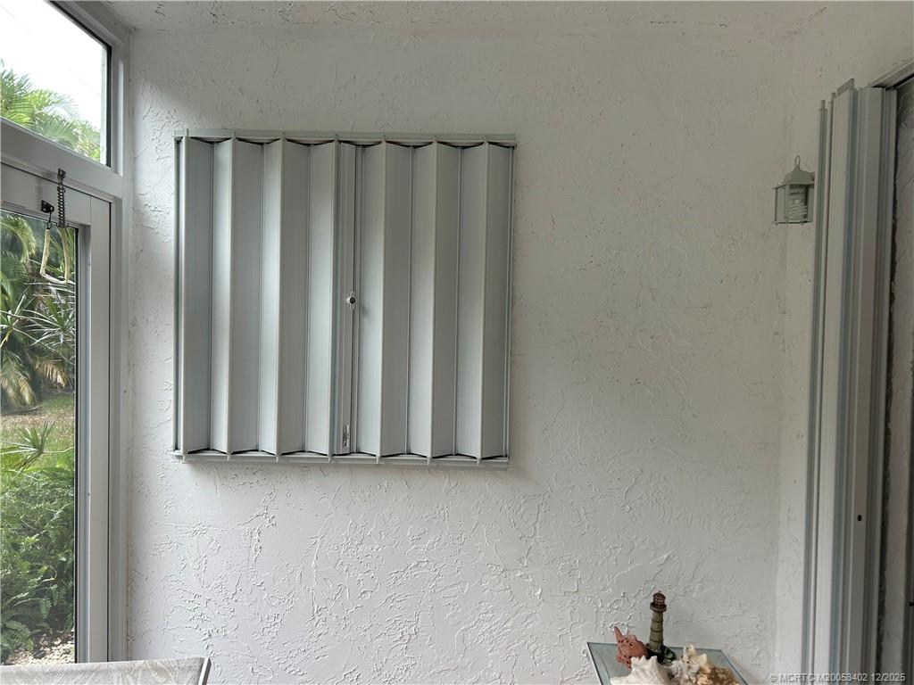 2950 Southeast Ocean Boulevard, Unit 1323 Stuart, FL 34996 - Photo 19 of 19 a view of a wooden door and shower