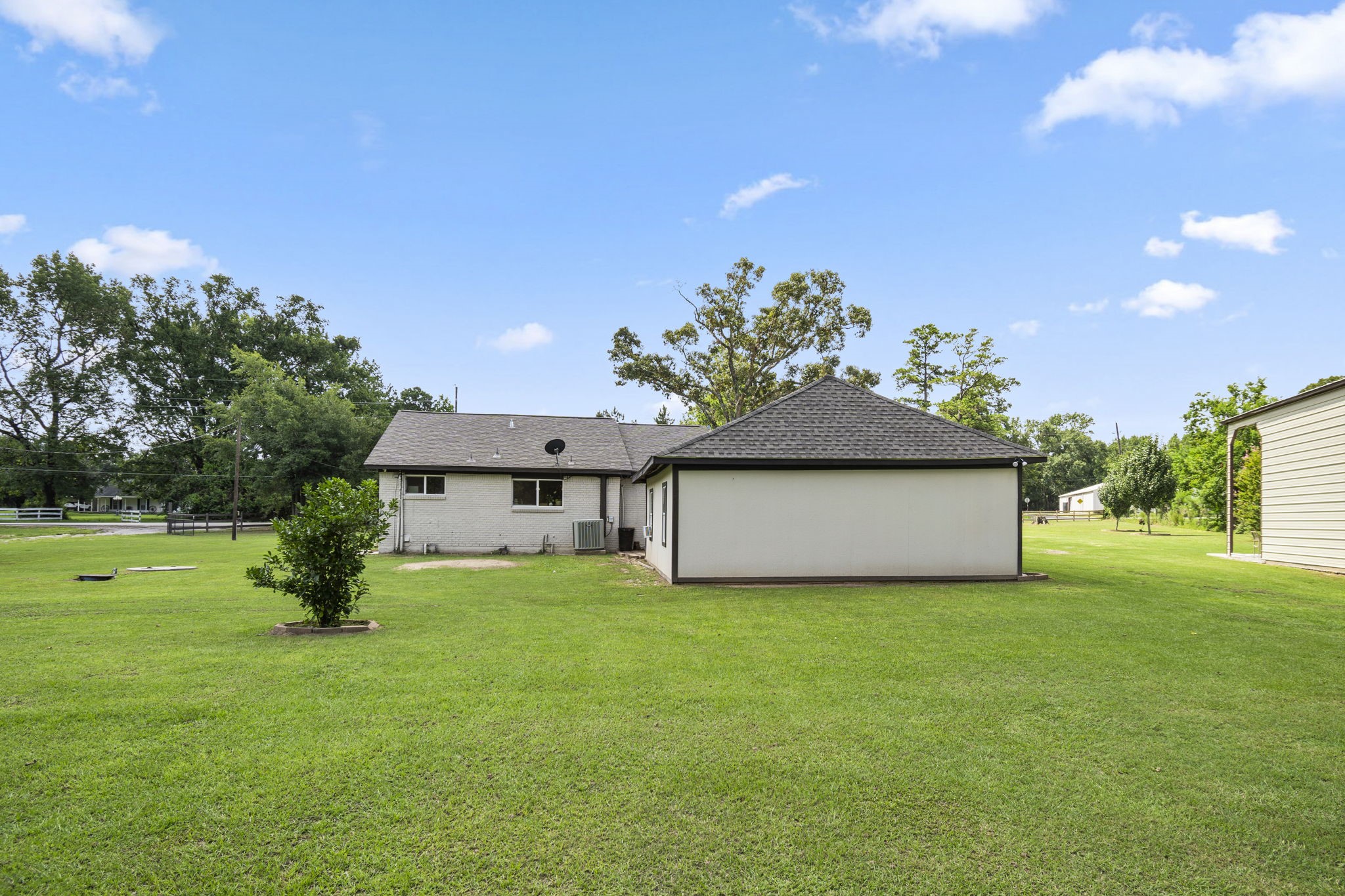 25311 Hardin Store Road Pinehurst, TX 77362 - Photo 31 of 39 a front view of a house with a yard and garage