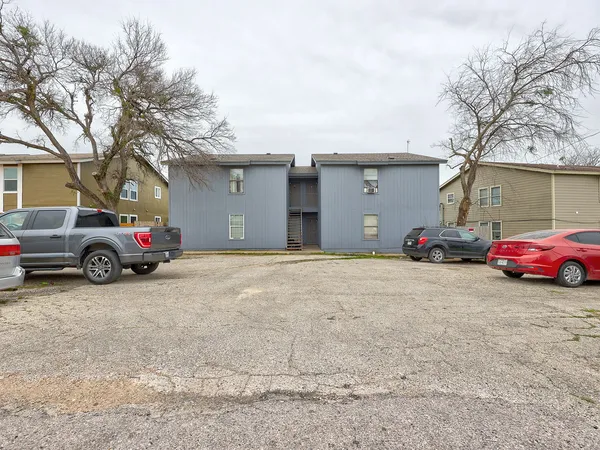 a view of a cars parked in front of a house