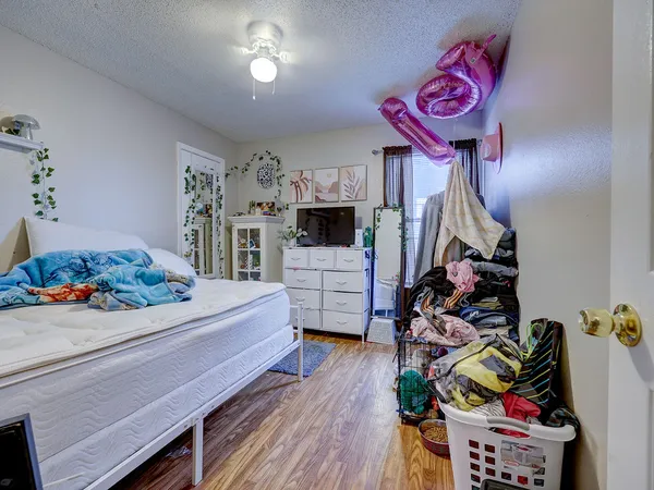 a bedroom with furniture and a bed
