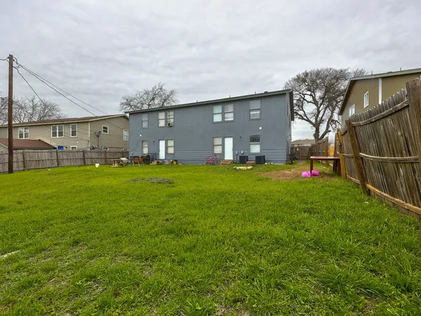 a front view of house with yard and outdoor seating