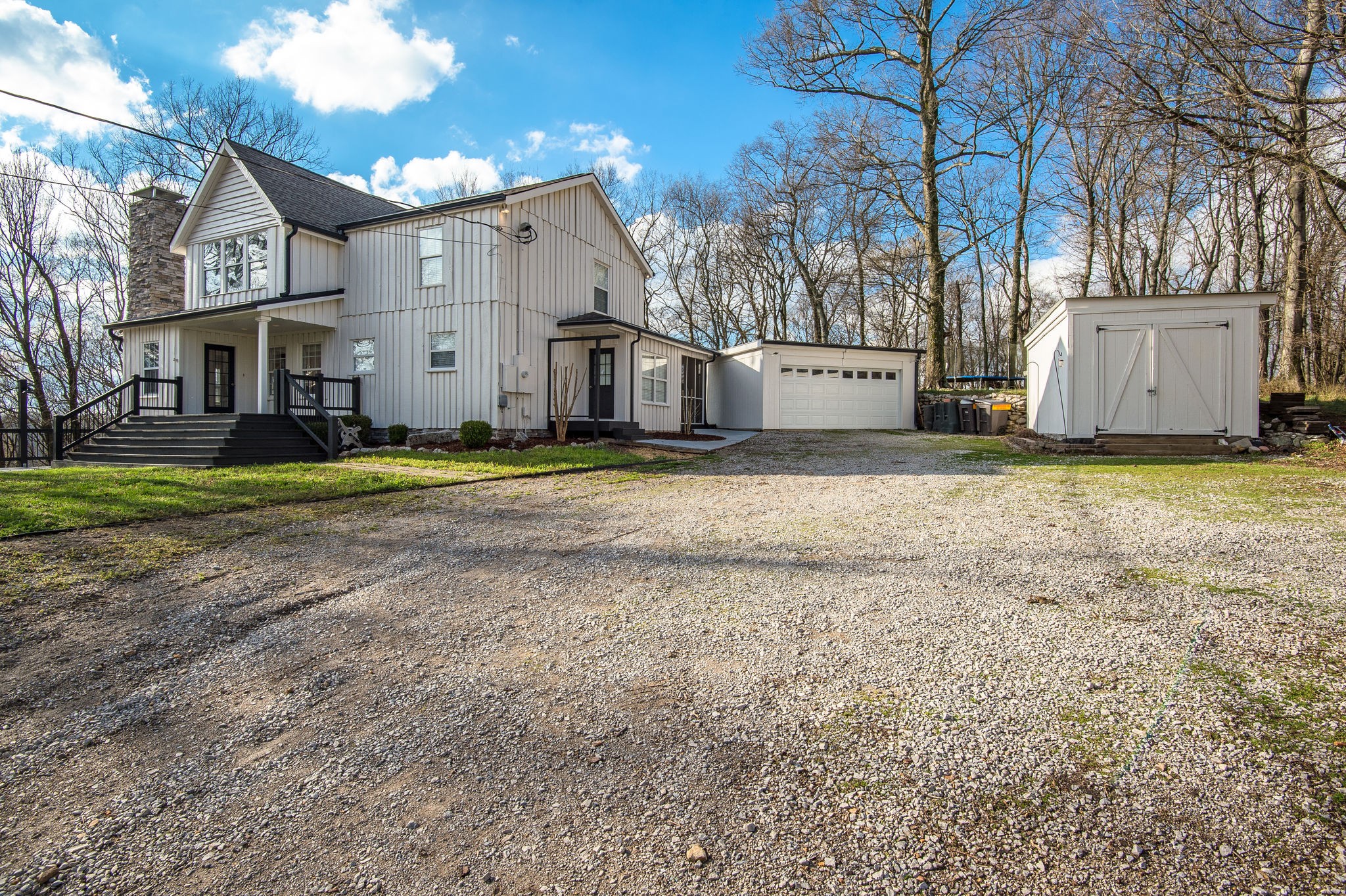 1111 Rip Steele Road Columbia, TN 38401 - Photo 3 of 50 a view of a big house with a big yard and large trees