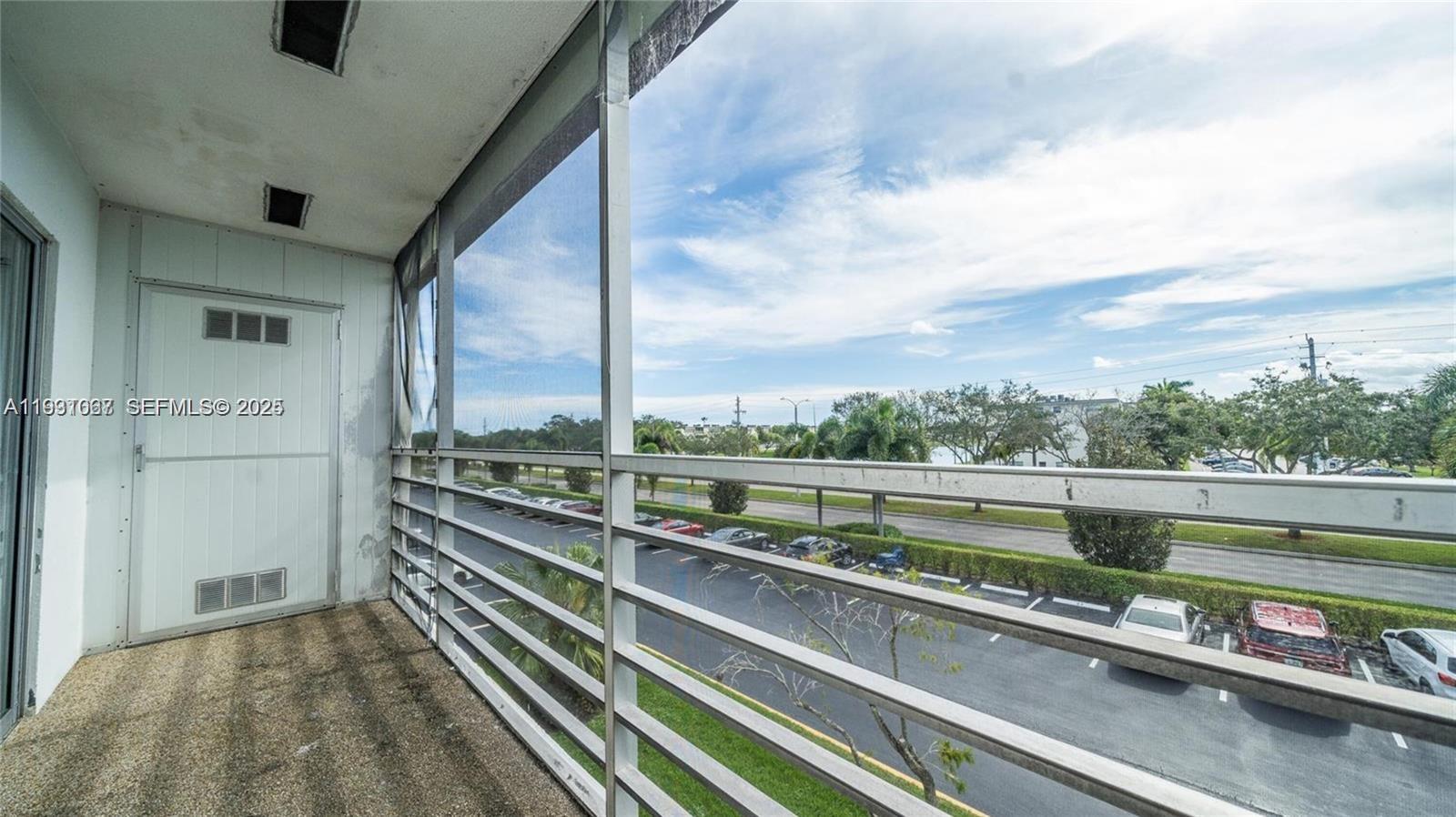 79 Suffolk B, Unit 79 Boca Raton, FL 33434 - Photo 9 of 10 a view of a balcony with city view