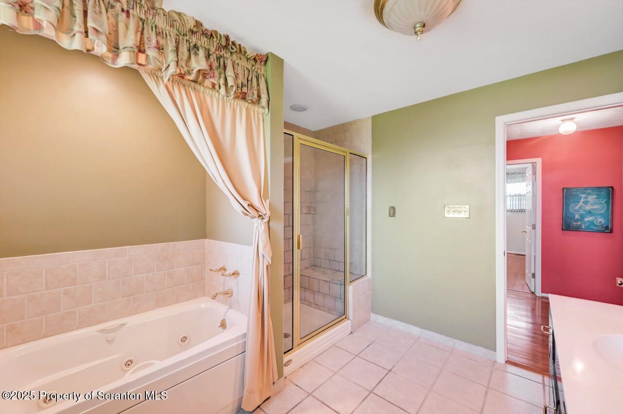 625 Cotter Street Moosic, PA 18507 - Photo 23 of 38 a bathroom with a bathtub and shower