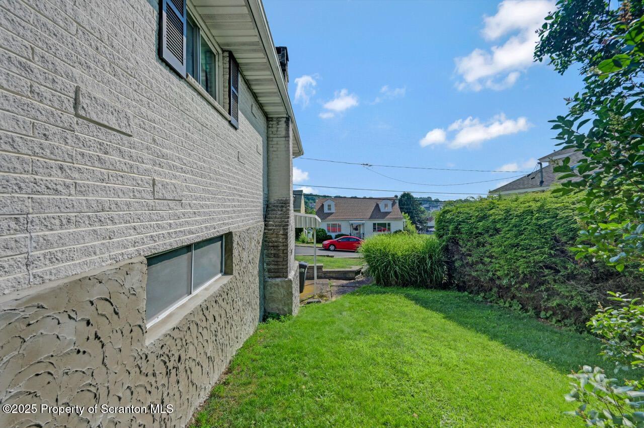 625 Cotter Street Moosic, PA 18507 - Photo 35 of 38 a view of a backyard both side of the house