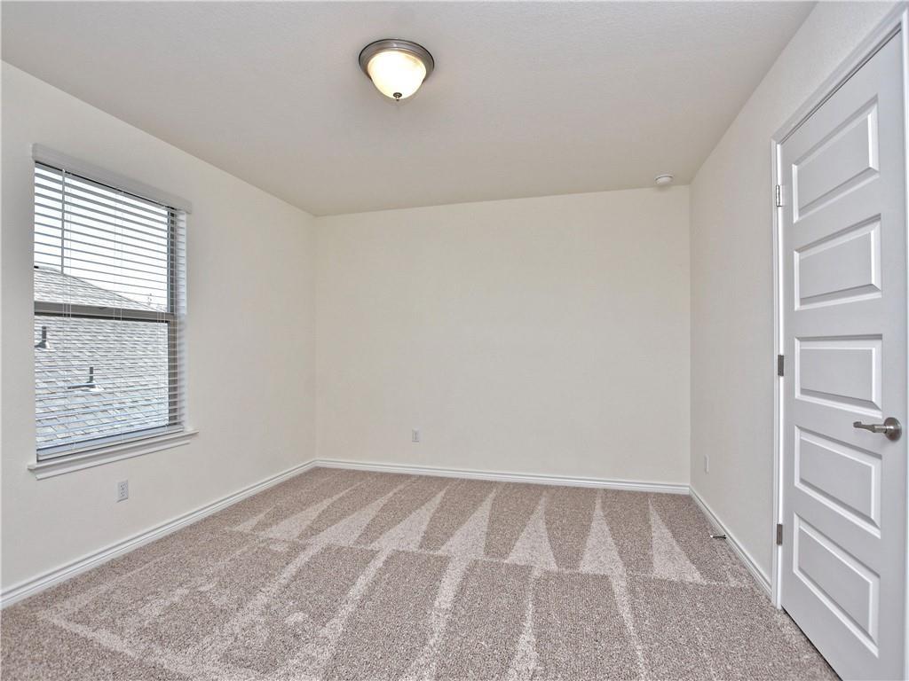 1836 Turtle Bay Loop Leander, TX 78641 - Photo 20 of 32 Room featuring neutral-toned walls, patterned carpet, and a window with blinds
