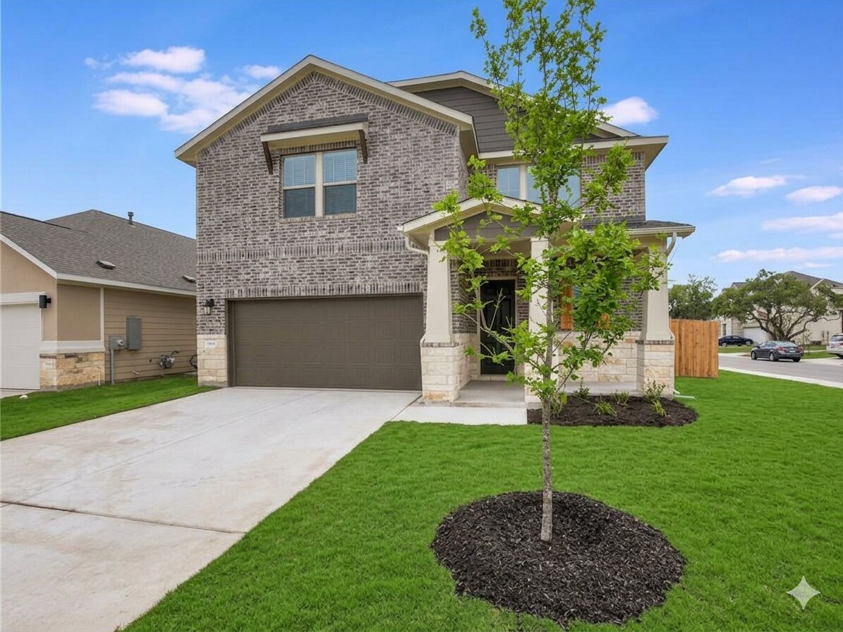 1836 Turtle Bay Loop Leander, TX 78641 - Photo 25 of 32 Two-story residence featuring a brick and stone facade, a two-car garage, and a covered front porch