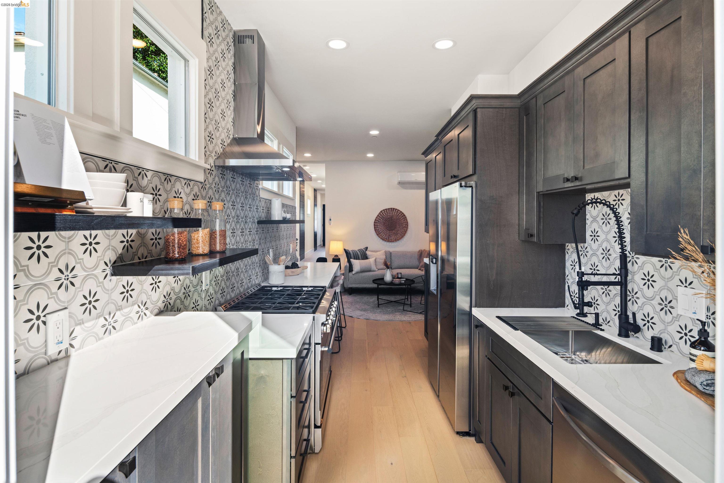 846 Adams Street Albany, CA 94706 - Photo 11 of 46 a kitchen with sink stove and cabinets