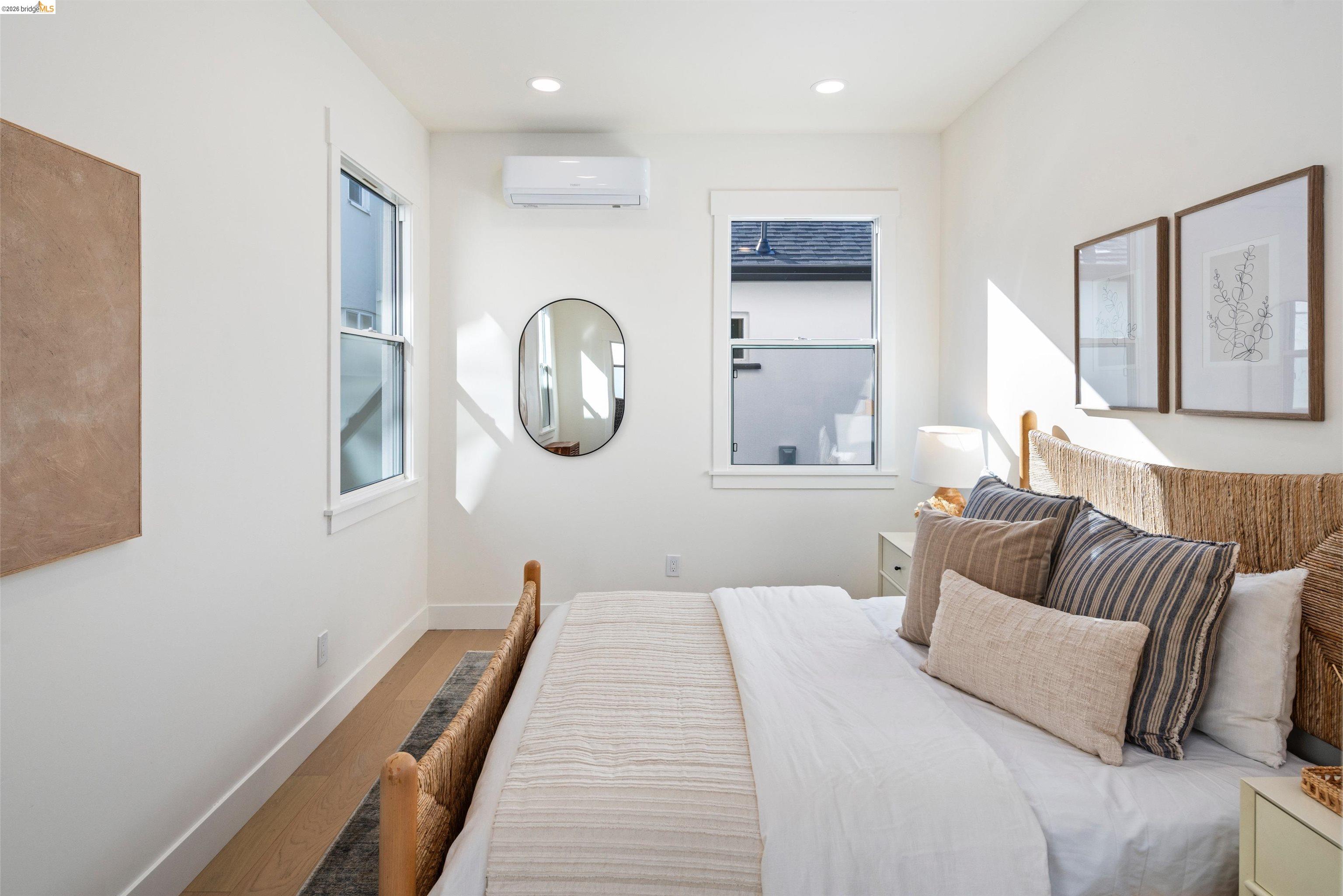 846 Adams Street Albany, CA 94706 - Photo 12 of 46 a bedroom with a bed and a mirror