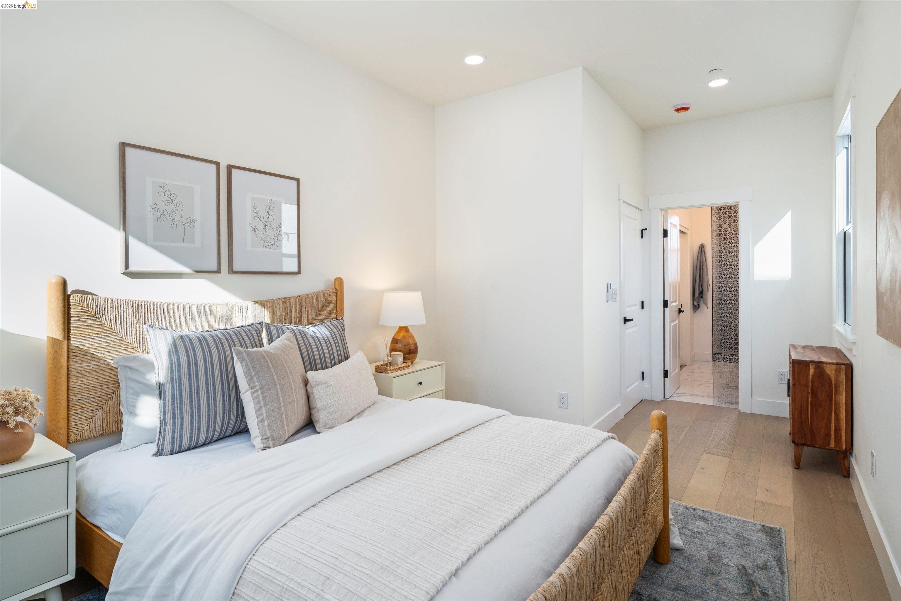 846 Adams Street Albany, CA 94706 - Photo 14 of 46 a bedroom with bed and mirror