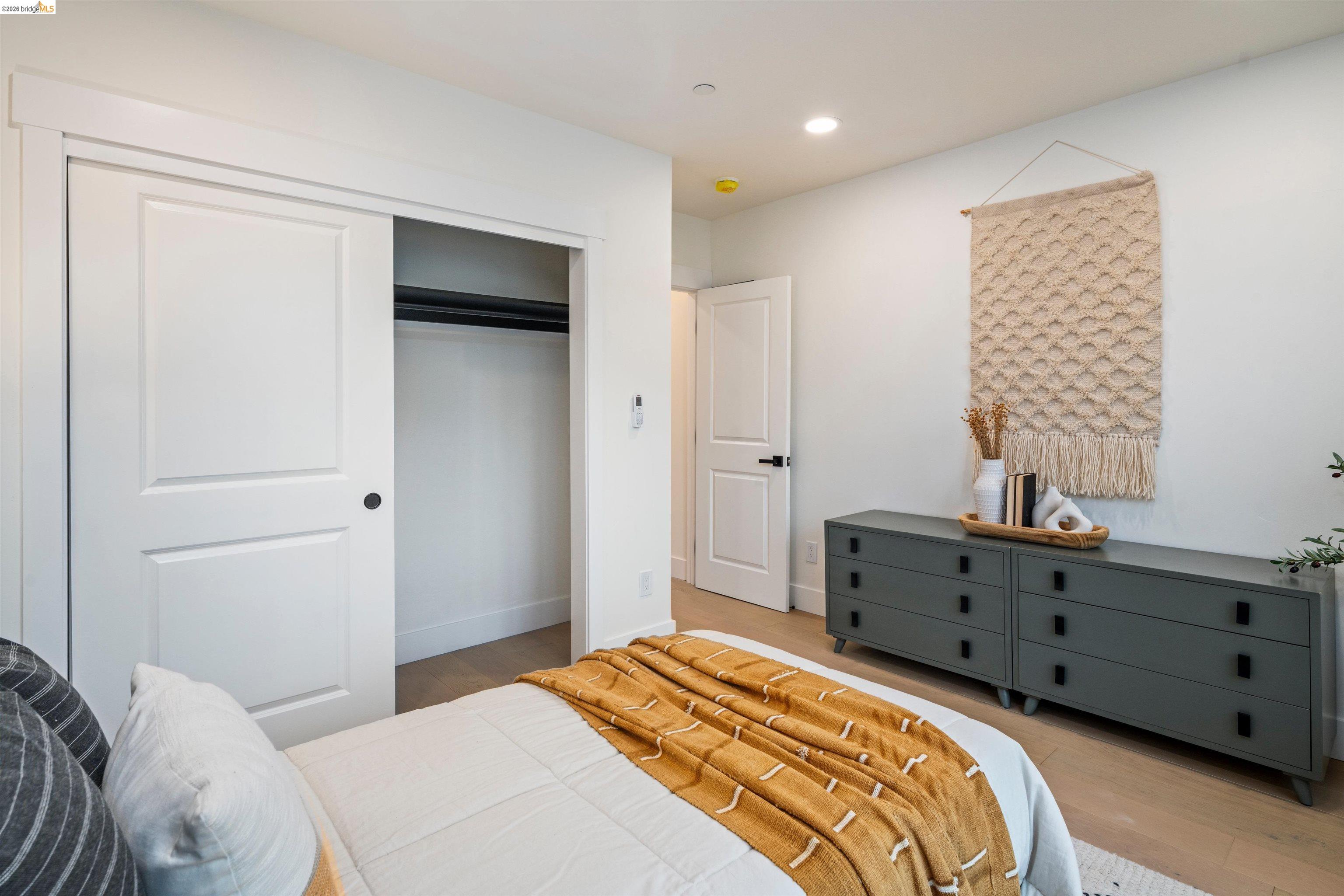 846 Adams Street Albany, CA 94706 - Photo 19 of 46 a bedroom with a bed and a dresser