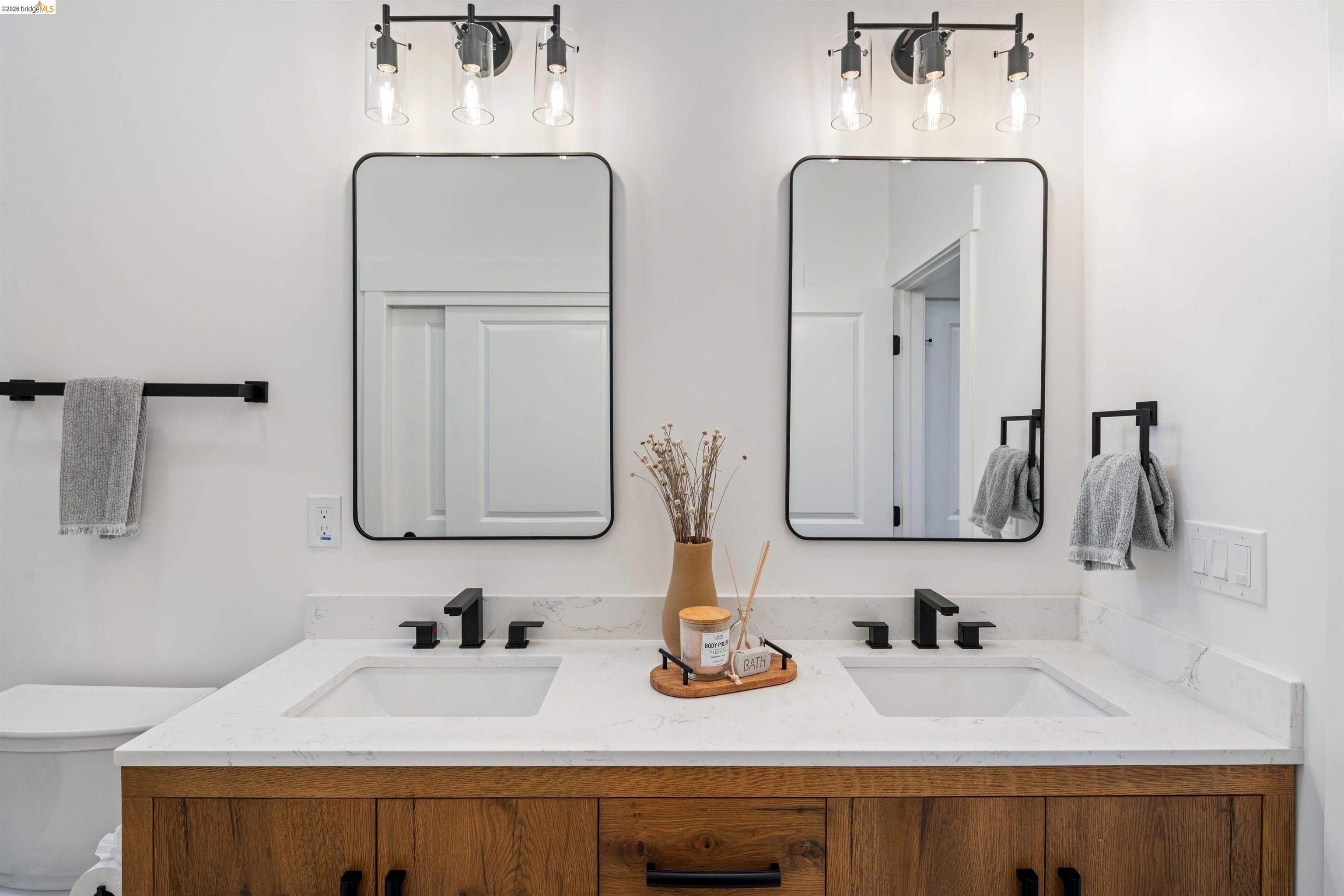 846 Adams Street Albany, CA 94706 - Photo 24 of 46 a bathroom with sink and mirror