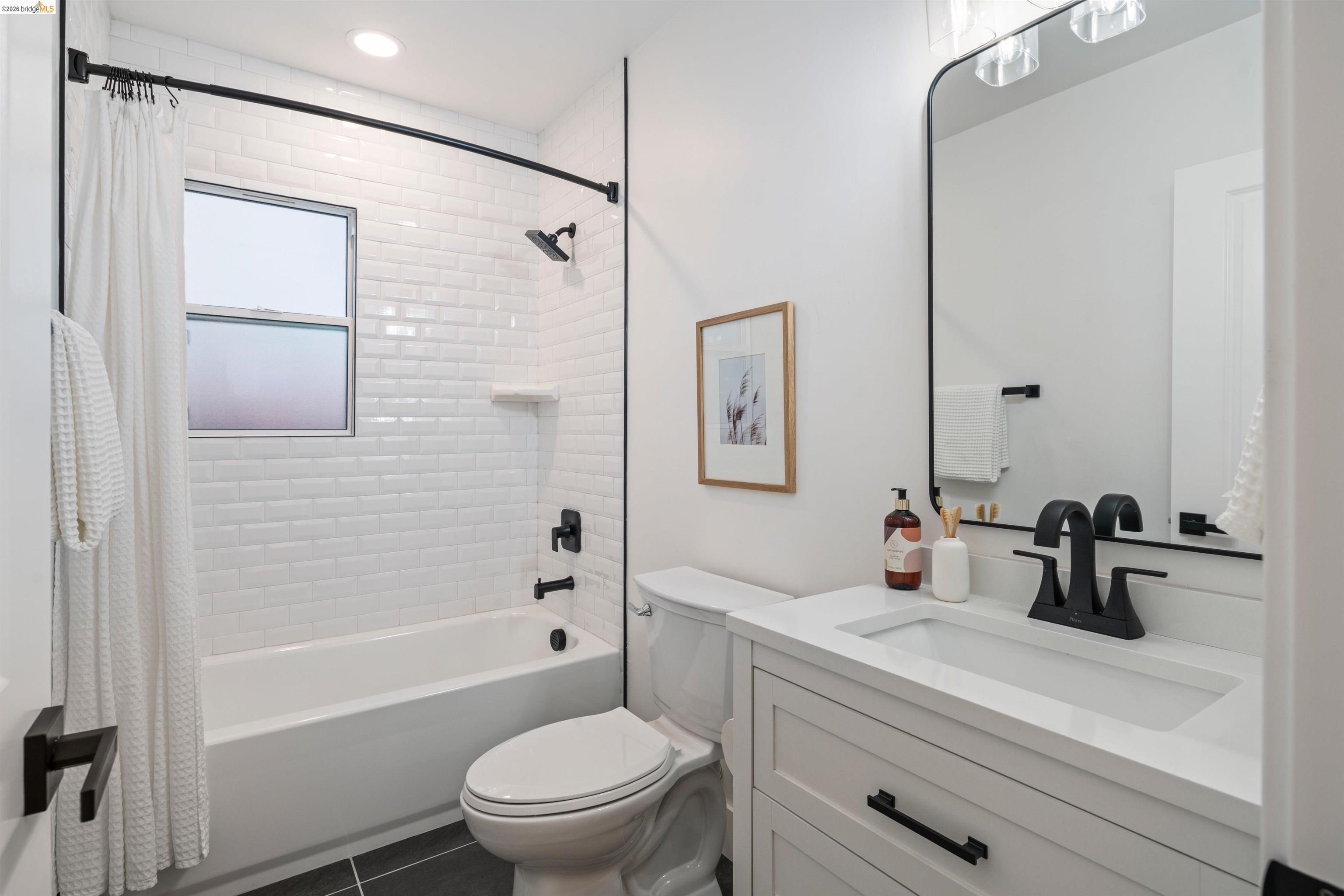 846 Adams Street Albany, CA 94706 - Photo 25 of 46 a bathroom with a sink a toilet and shower