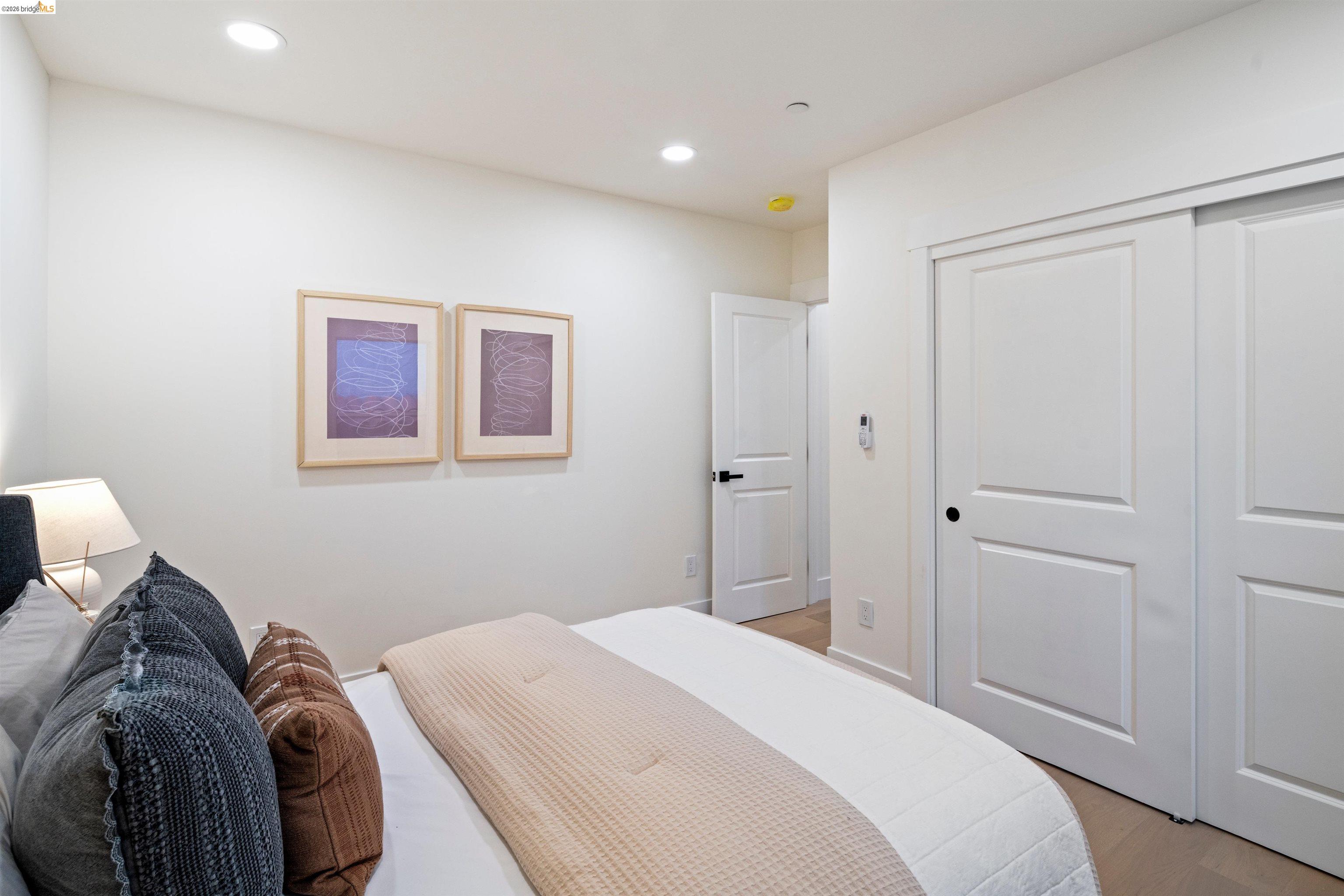 846 Adams Street Albany, CA 94706 - Photo 27 of 46 a bedroom with a bed and a window