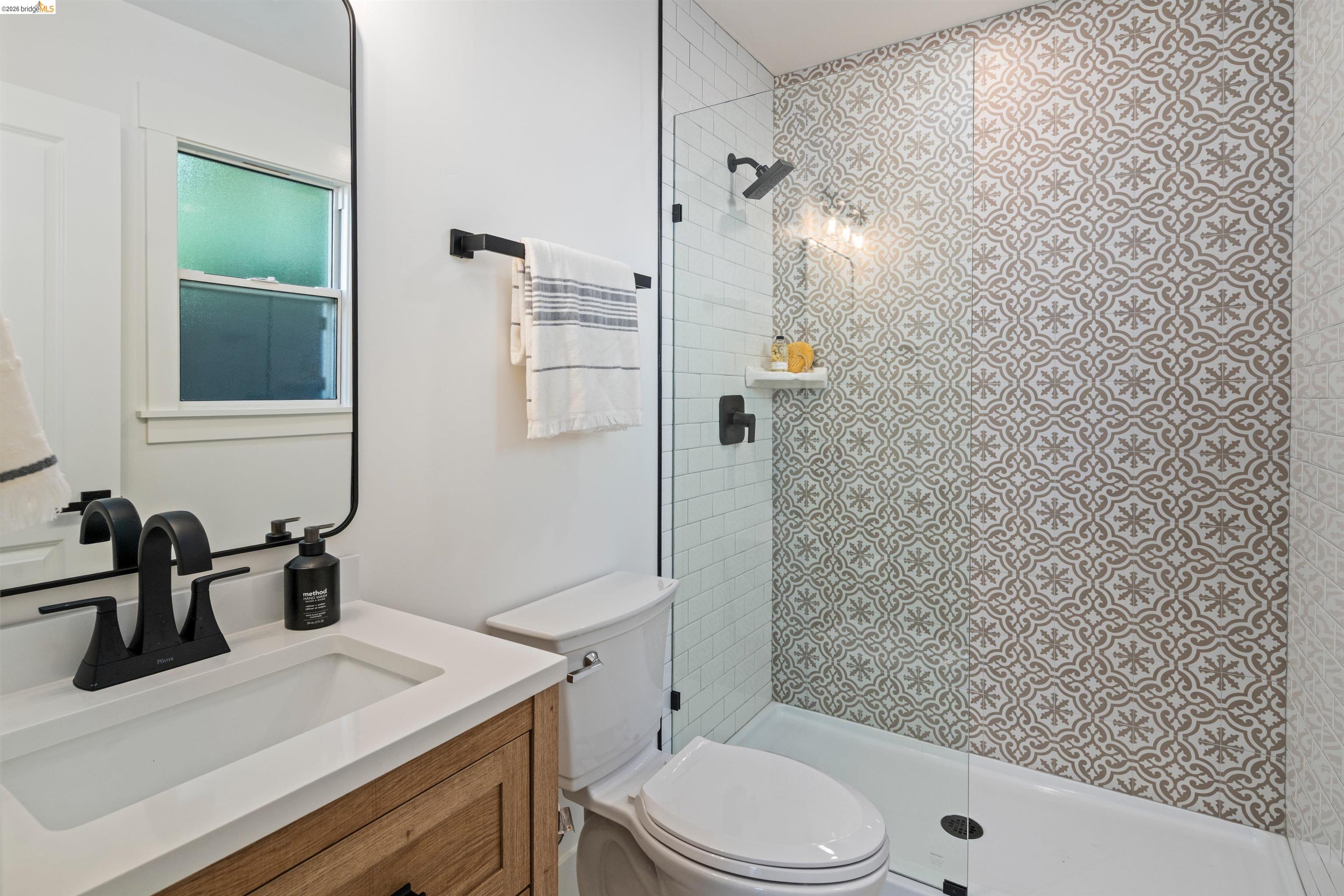 846 Adams Street Albany, CA 94706 - Photo 38 of 46 a bathroom with a sink a toilet and shower