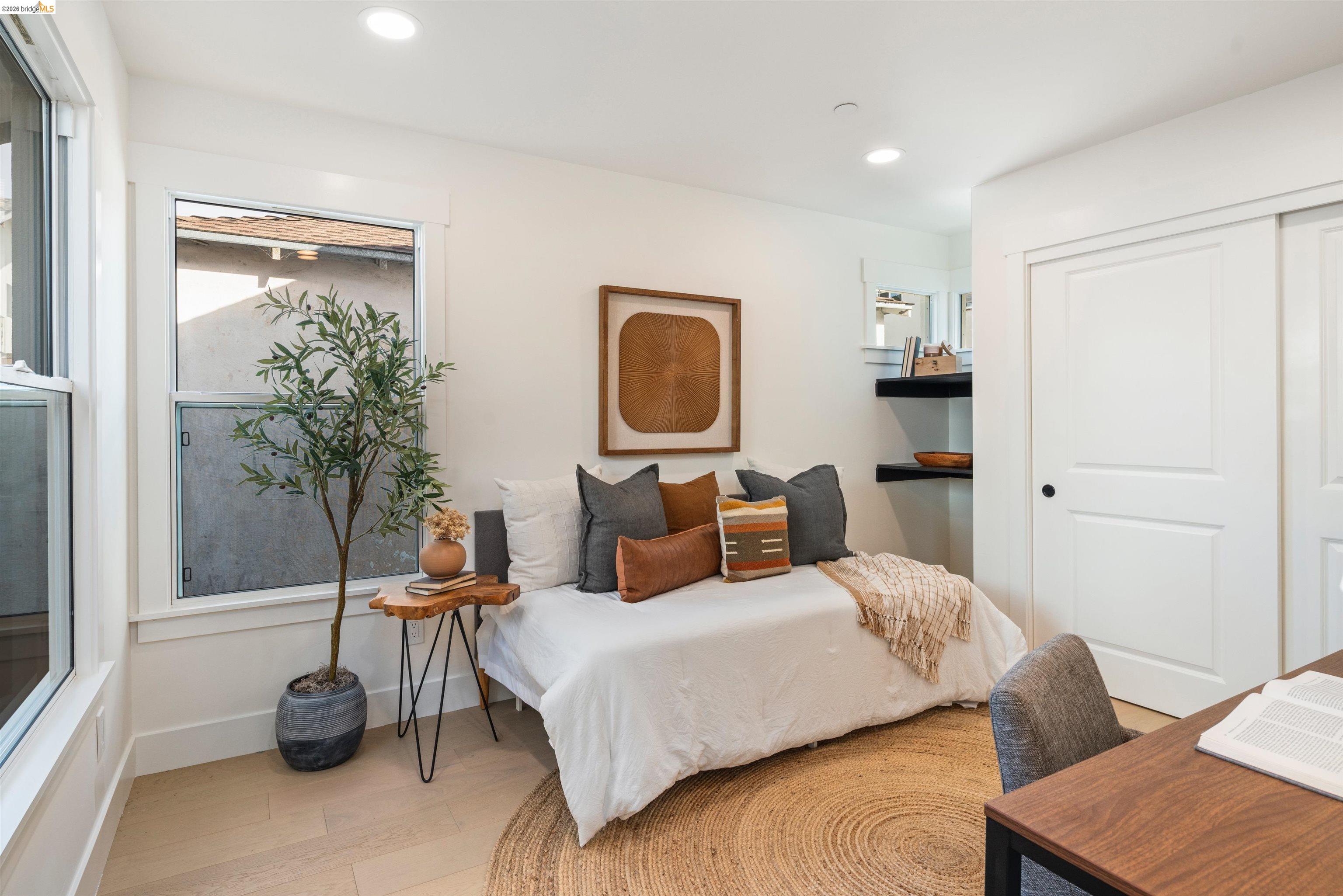 846 Adams Street Albany, CA 94706 - Photo 40 of 46 a bedroom with a bed and a potted plant
