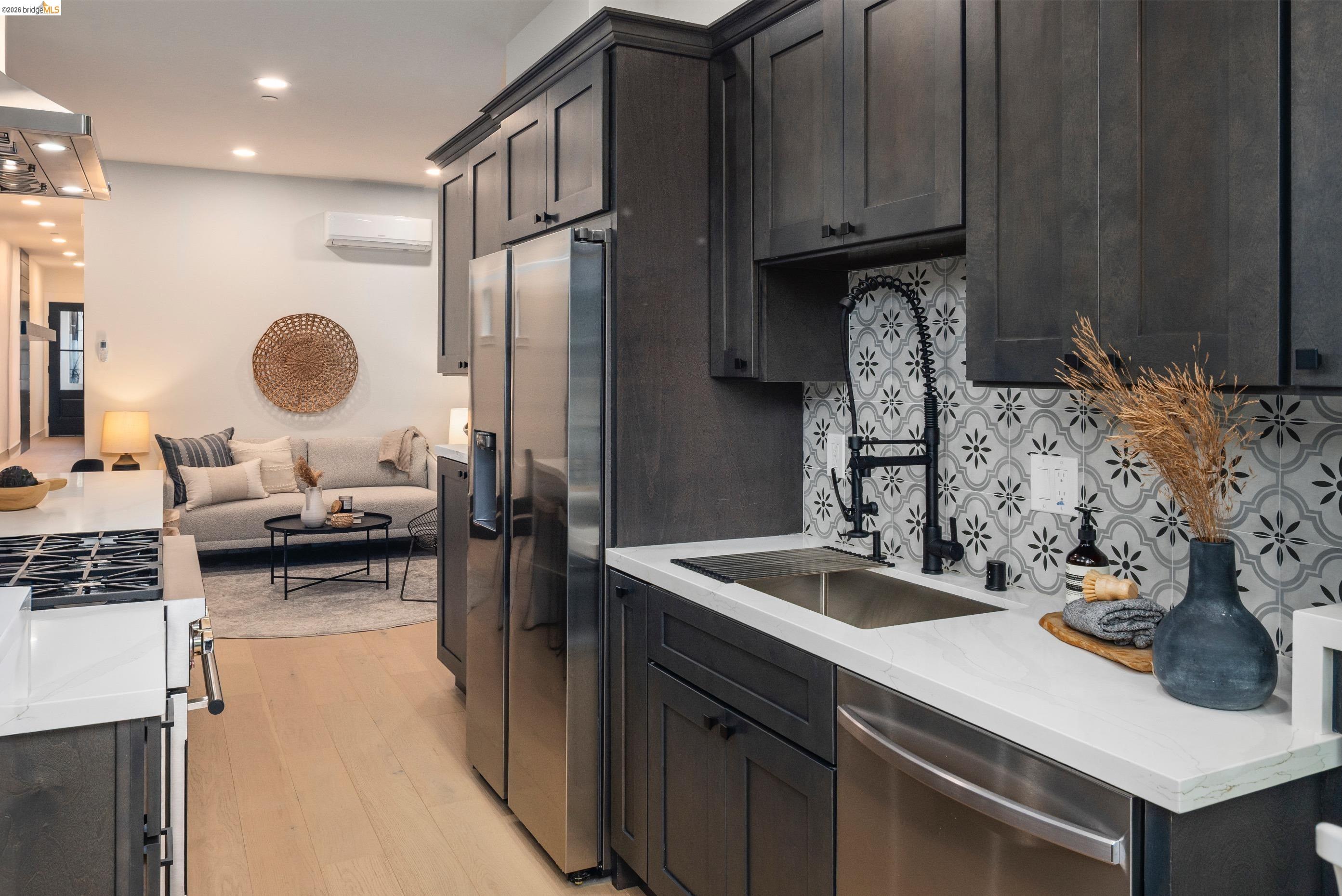 846 Adams Street Albany, CA 94706 - Photo 10 of 46 a kitchen with a sink refrigerator and cabinets