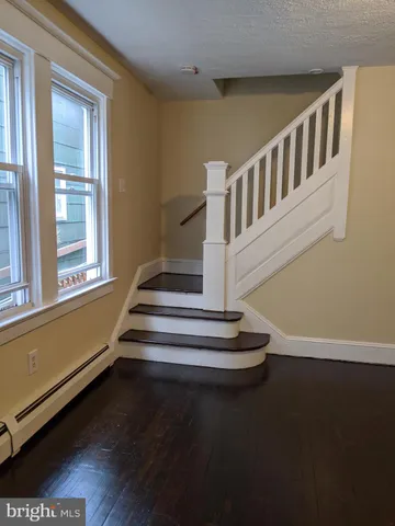a view of entryway with wooden floor