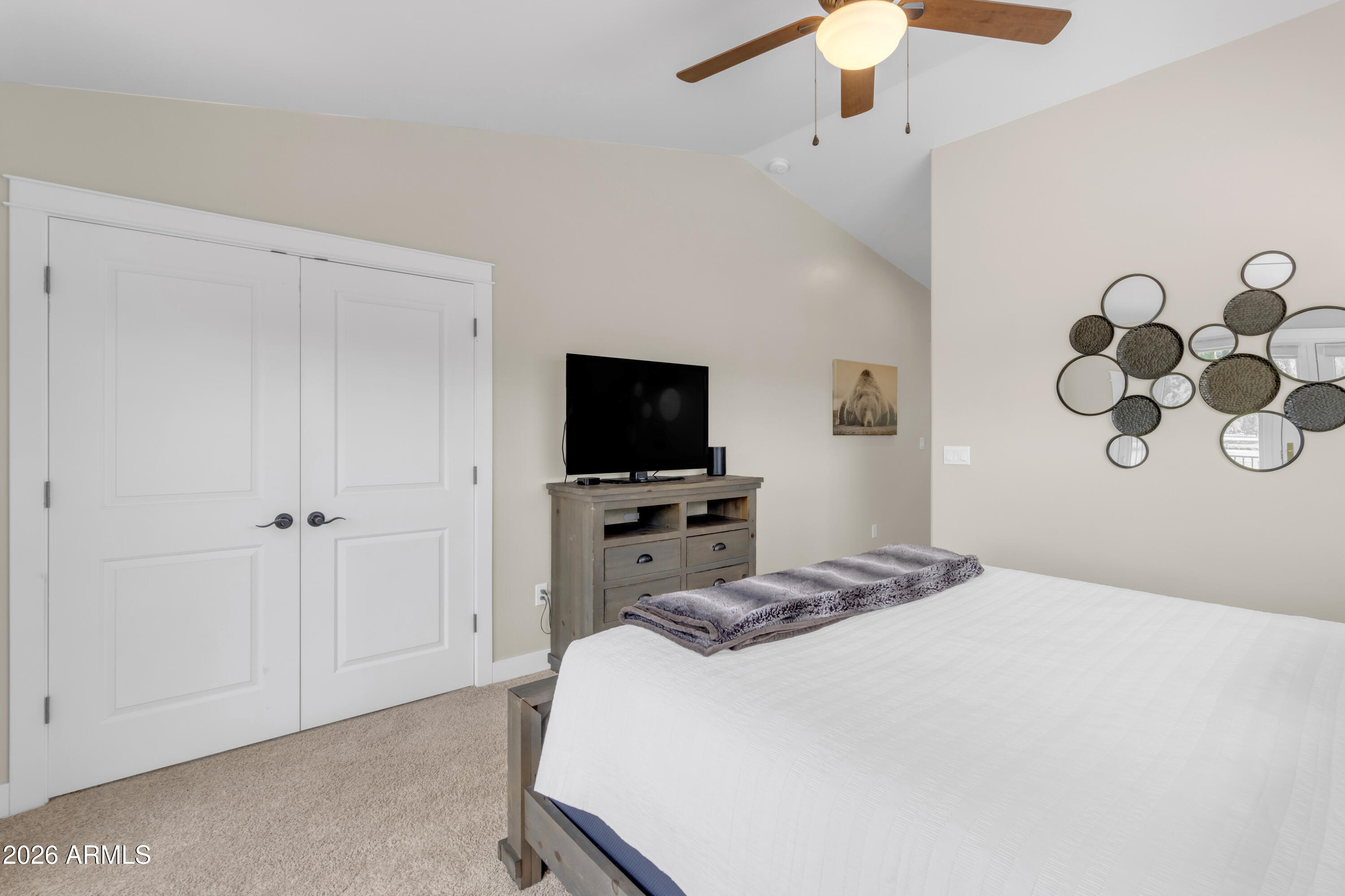 17975 Hopi Road Munds Park, AZ 86017 - Photo 28 of 58 a bedroom with a bed and a tv