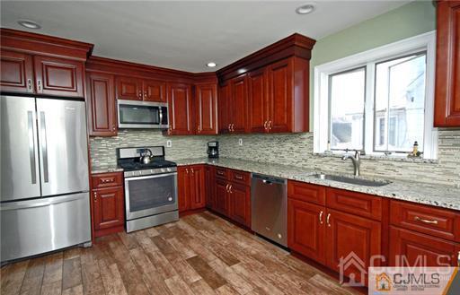 340 Bound Brook Road Middlesex, NJ 08846 - Photo 13 of 22 a kitchen with stainless steel appliances granite countertop a refrigerator stove top oven and sink