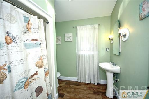 340 Bound Brook Road Middlesex, NJ 08846 - Photo 16 of 22 a bathroom with a sink and a mirror