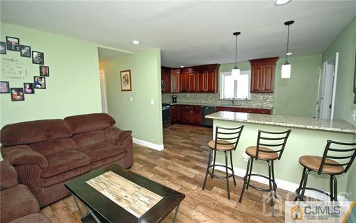 340 Bound Brook Road Middlesex, NJ 08846 - Photo 17 of 22 a living room with furniture and a wooden floor