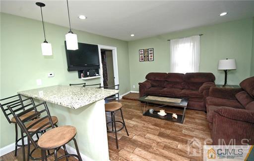 340 Bound Brook Road Middlesex, NJ 08846 - Photo 19 of 22 a living room with furniture and a flat screen tv