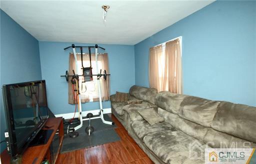 340 Bound Brook Road Middlesex, NJ 08846 - Photo 4 of 22 a bed sitting in a bedroom next to a window with pc on the table