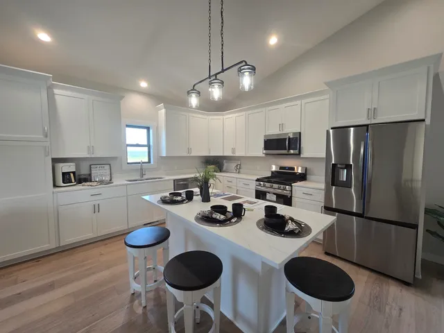 a view of wooden floor and windows in a room