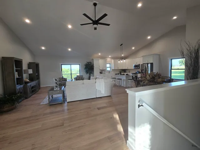 a large bed sitting in a bedroom next to a window