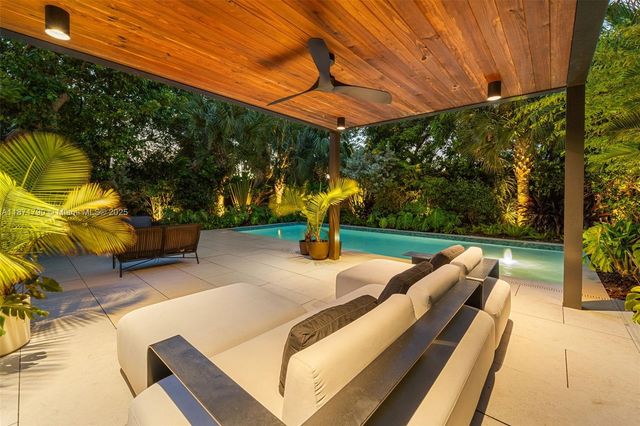 a view of swimming pool with a patio