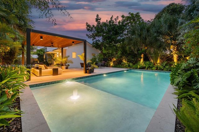 a view of a swimming pool with a patio