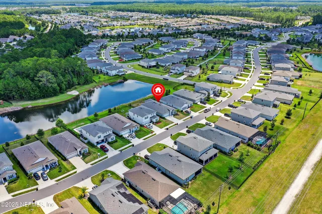 a view of multiple houses with yard