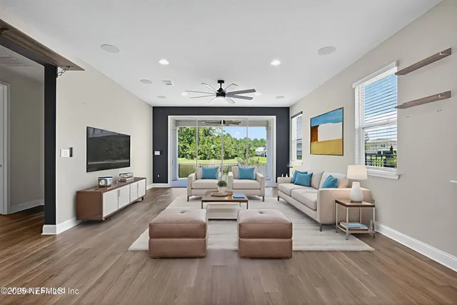 a living room with fireplace furniture and a flat screen tv