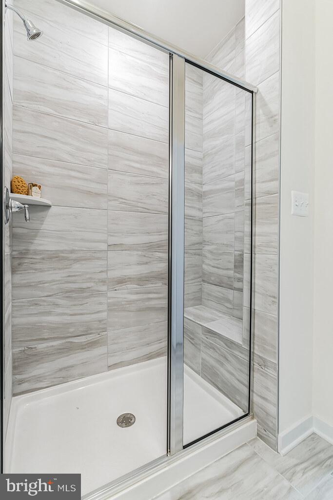 3636 Dexter Court, Unit HARPER142 Aberdeen, MD 21001 - Photo 2 of 40 a bathroom with a glass shower door