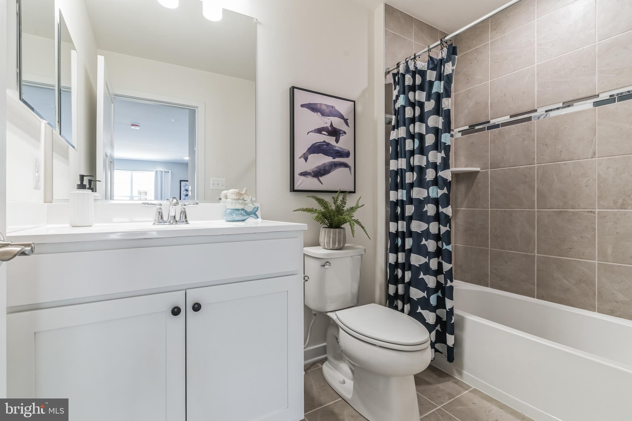 3636 Dexter Court, Unit HARPER142 Aberdeen, MD 21001 - Photo 3 of 40 a bathroom with a sink a toilet and shower