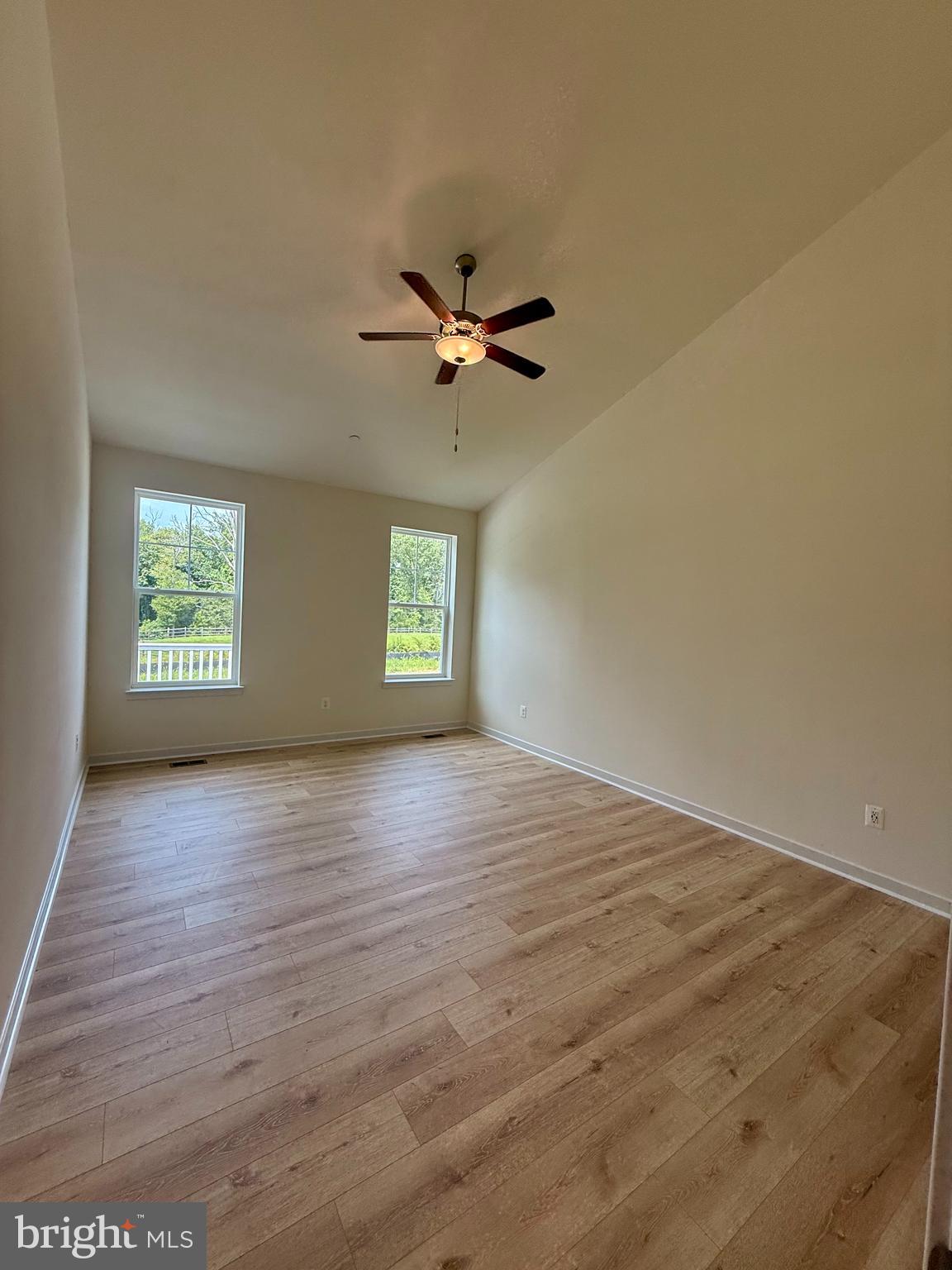 3636 Dexter Court, Unit HARPER142 Aberdeen, MD 21001 - Photo 36 of 40 an empty room with a window and a ceiling fan