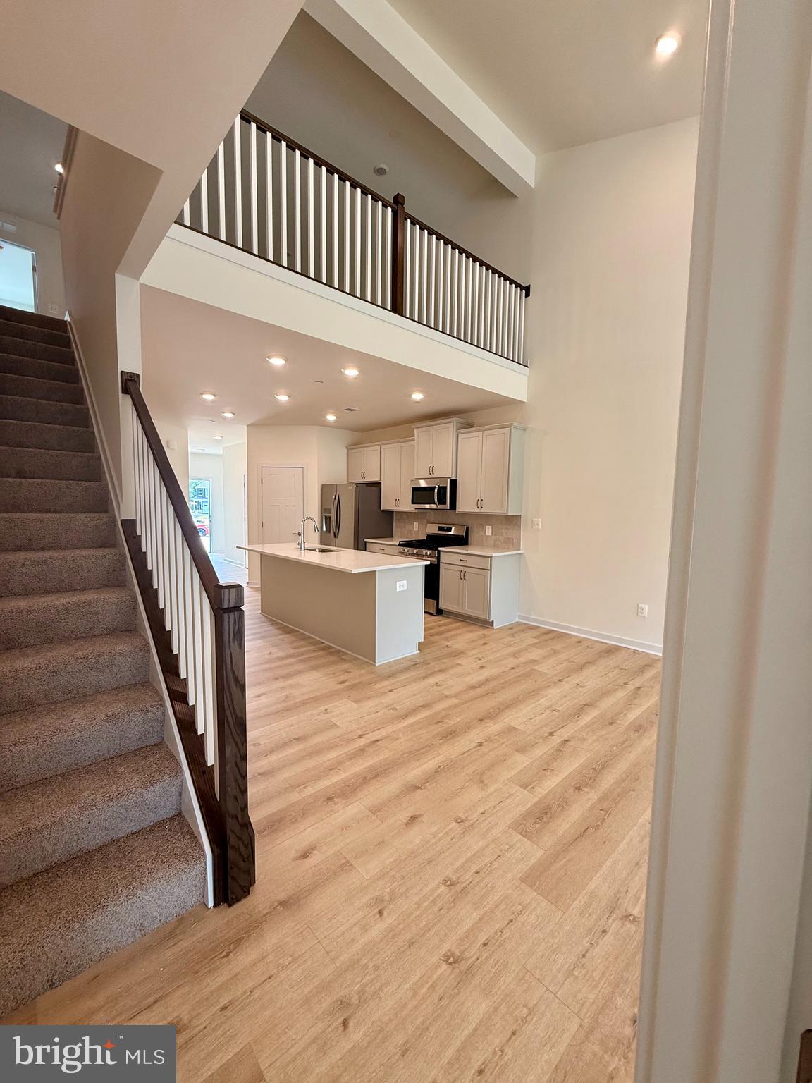 3636 Dexter Court, Unit HARPER142 Aberdeen, MD 21001 - Photo 38 of 40 a view of a hallway with wooden floor and staircase