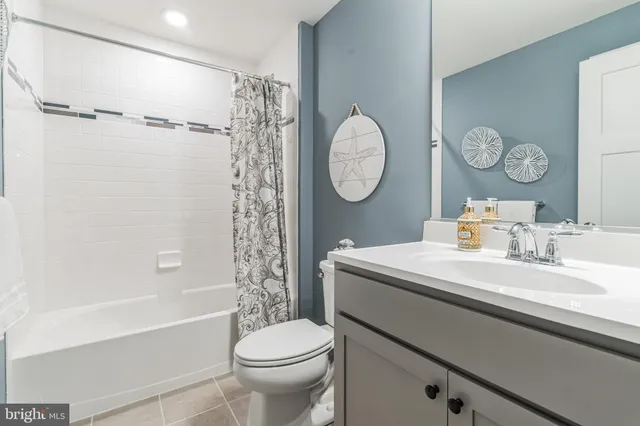 a bathroom with a sink a toilet and a bathtub