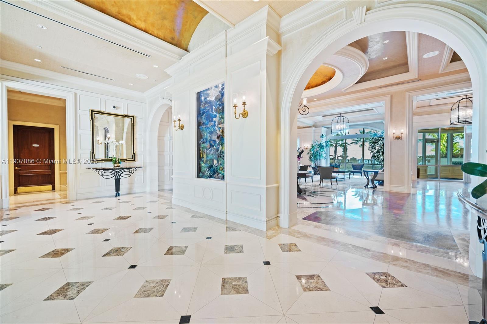 16051 Collins Avenue, Unit 1202 Sunny Isles Beach, FL 33160 - Photo 32 of 32 a view of a livingroom with wooden floor and a large window